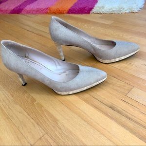 Stuart Weitzman platform nude pumps.